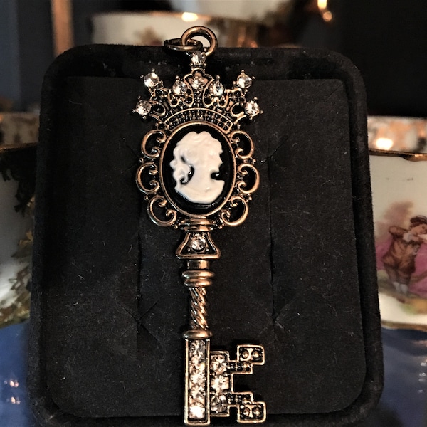 Lovely cameo skeleton key pendant / keychain / décor; Black & white with goldtone and crystals
