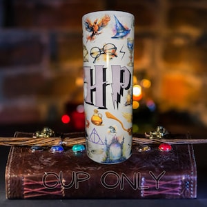 May include: A white stainless steel tumbler with a Harry Potter themed design. The tumbler features the letters "HP" in a purple font, along with various Harry Potter symbols and imagery, including a phoenix, a wizard's hat, glasses, a wand, and the Deathly Hallows symbol.
