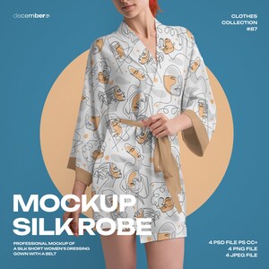May include: A white silk robe with a brown belt. The robe has a pattern of abstract faces in black and orange lines. The robe is worn by a person with red hair.
