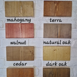 May include: Wood samples in various shades of brown, red, and yellow. The samples are labeled with the wood type: medium oak, rosewood, mahogany, terra, walnut, natural oak, cedar, and dark oak.