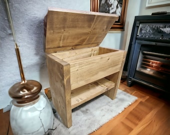 May include: A wooden storage bench with a hinged lid and a shelf. The bench is made of natural wood with a rustic finish.