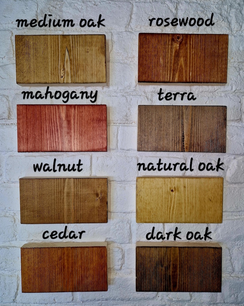 May include: Eight wood samples stained in different colors, labeled with their names: medium oak, rosewood, mahogany, terra, walnut, natural oak, cedar, and dark oak.