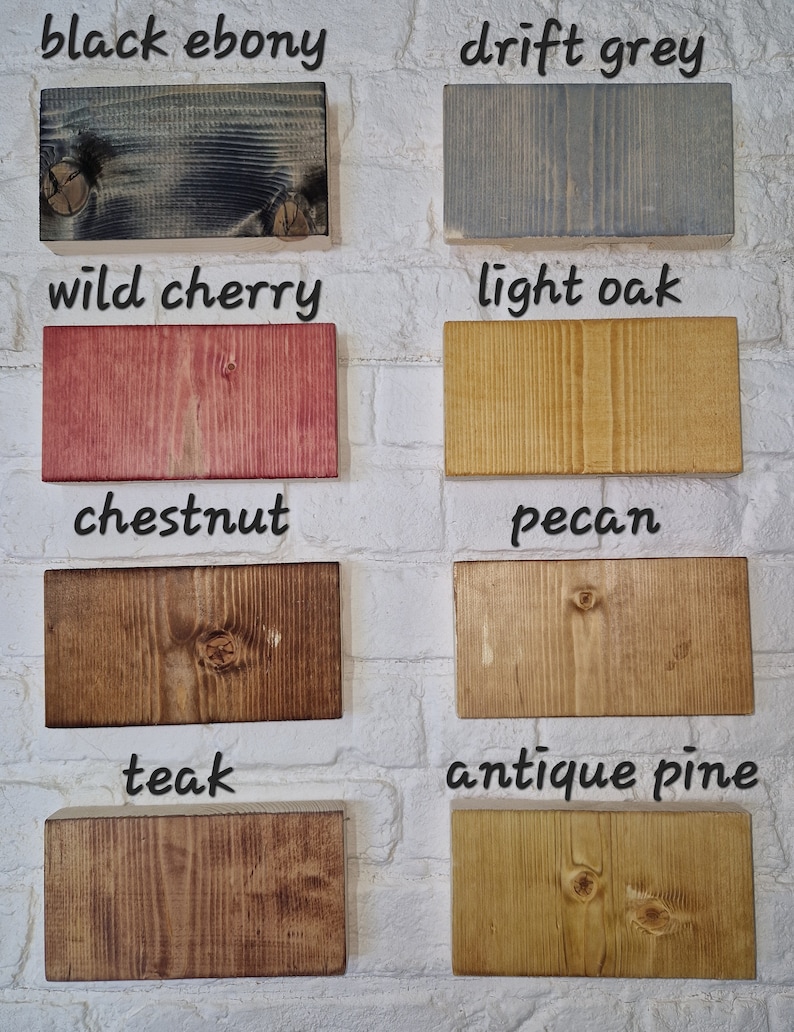 May include: A collection of wood samples in various colors and finishes, including black ebony, drift grey, wild cherry, light oak, chestnut, pecan, teak, and antique pine.