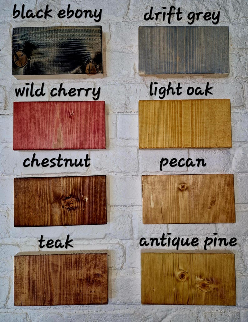 May include: Eight wood samples stained in different colors, including black ebony, drift grey, wild cherry, light oak, chestnut, pecan, teak, and antique pine.