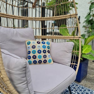 Handmade crochet daisy cushion cover.