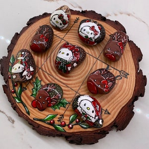 Hand painted Rocks Tic-Tac-Toe set. Set of 10 Christmas themed rocks and a wood slice, hand painted. One of a kind, unique, and detailed.