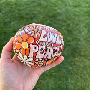 Love and peace rock, hand painted orange color daisy flowers rock