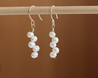 Gold Wedding Earrings With Pearls Kissing Each Other