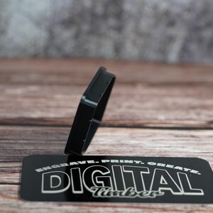 Black PETG dust plug with textured finish displayed on Digital Timber branding card