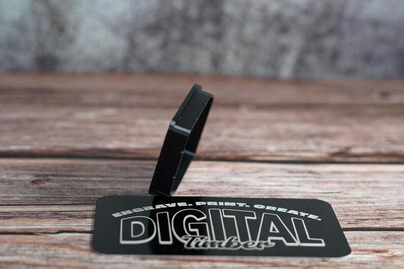 Black PETG dust plug with textured finish displayed on Digital Timber branding card