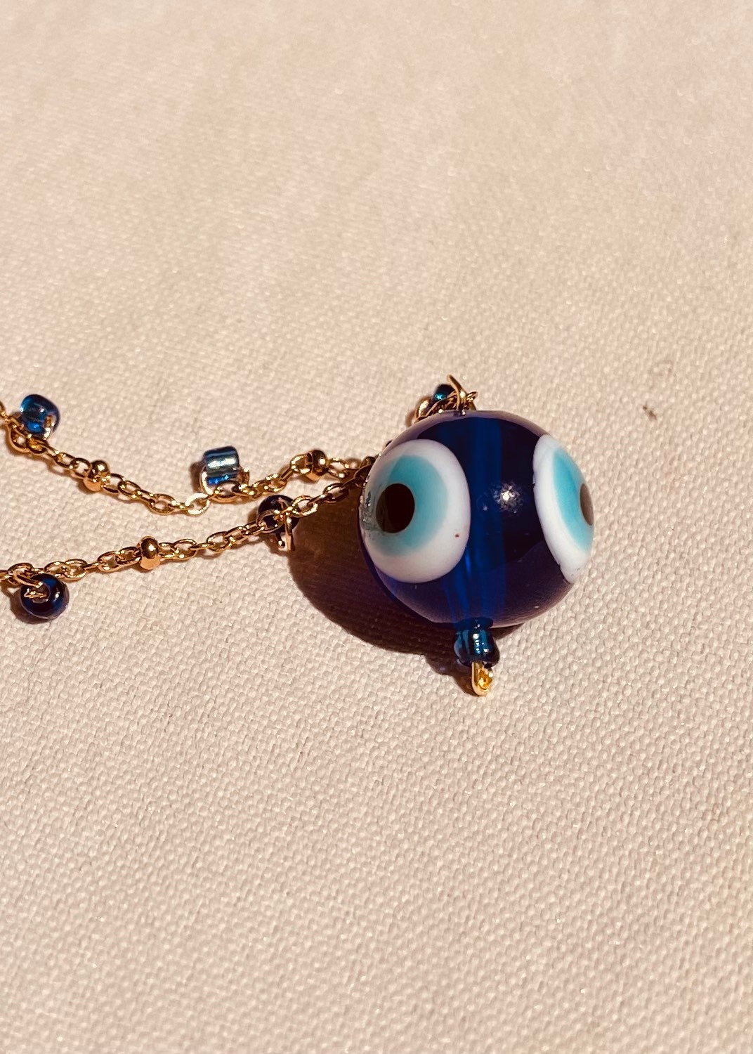 Collana choker Siren's Song con occhio turco e perle di fiume