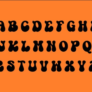 May include: Black alphabet letters in a retro, groovy font style. The letters are outlined in black and have a rounded, bubbly appearance. The letters are arranged in two rows, with the first row containing the letters A through I and the second row containing the letters J through Z.