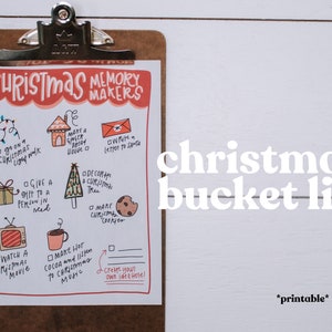 May include: A clipboard holds a Christmas bucket list with illustrations and text. The list includes activities like watching a movie, making cookies, and writing to Santa. The words "Christmas Memory Makers" and "Christmas bucket list" are also visible.
