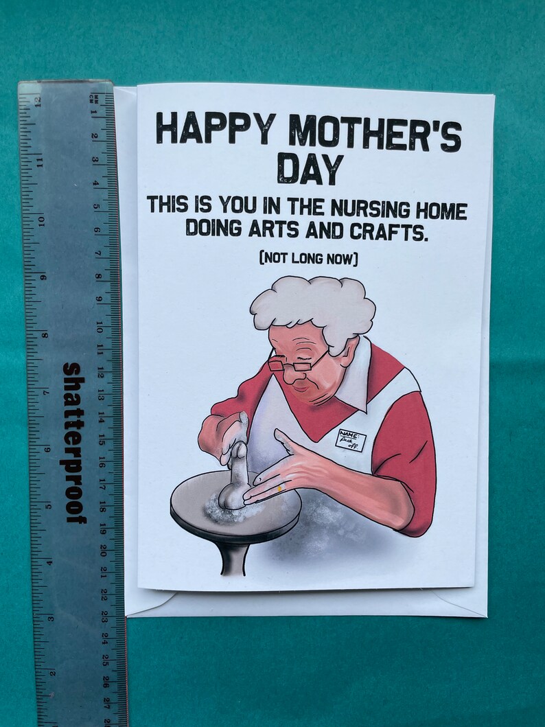 May include: A humorous greeting card with a cartoon illustration of an older person making pottery. The card reads "Happy Mother's Day. This is you in the nursing home doing arts and crafts. (Not long now)"
