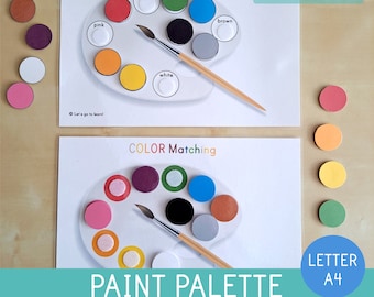 May include: A color matching game featuring paint palettes with various colors and matching circular pieces. The text "COLOR Matching" and "PAINT PALETTE COLOR MATCHING GAME" are visible. The game includes two options and is designed for educational purposes.