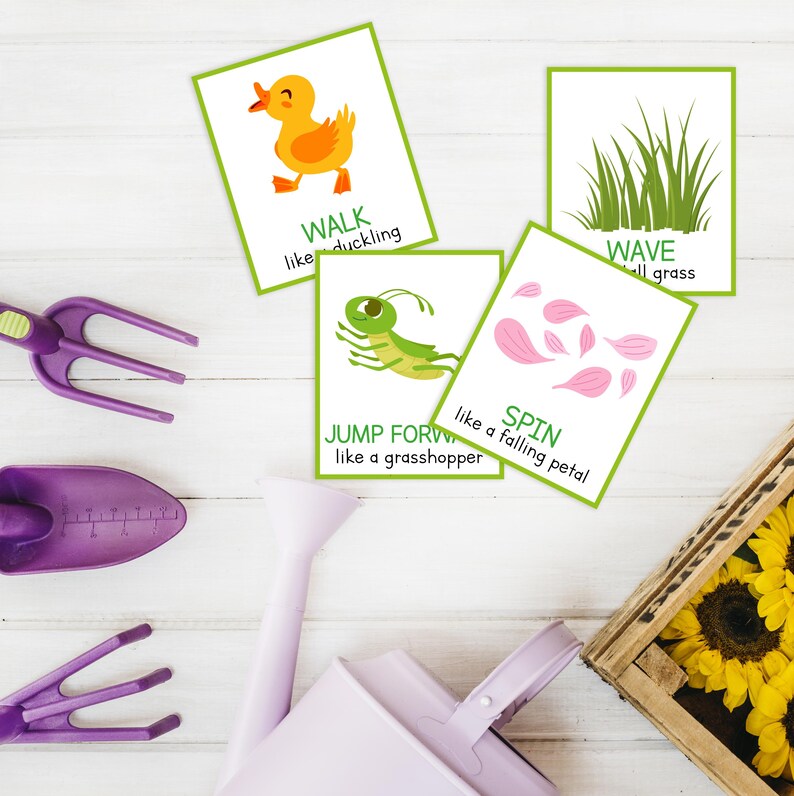 May include: Four illustrated cards with green borders and text: "WALK like duckling", "WAVE tall grass", "JUMP FORWARD like a grasshopper", and "SPIN like a falling petal". Gardening tools and a watering can in shades of purple are also visible.