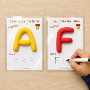 May include: Two laminated educational activity cards with the text I can make the letter. One card features a yellow clay letter A, the other a red clay letter F. Both cards include illustrations of a rolling pin and a clay tub, plus dotted letters to trace.