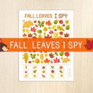 Puede incluir: Una hoja de juego impresa "Fall Leaves I Spy". El juego presenta ilustraciones coloridas de varias hojas de otoño, con una sección de emparejamiento en la parte inferior. Una pancarta naranja en la imagen dice "Fall Leaves I Spy" con un erizo de dibujos animados y una hoja roja.