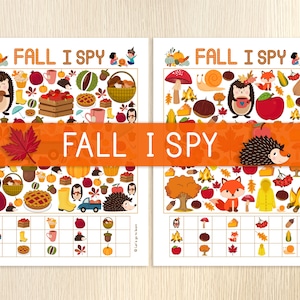 May include: Two printable Fall I Spy activity sheets with a grid for checking off items. The sheets feature a variety of fall-themed images, including pumpkins, leaves, acorns, and a hedgehog.