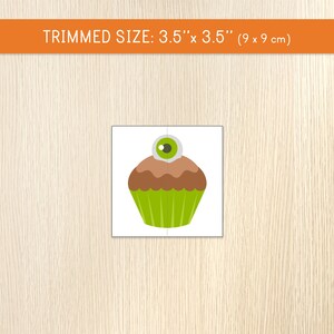 May include: A Halloween-themed puzzle featuring a cartoon cupcake with a brown top, green wrapper, and a large eyeball on top. The trimmed size is 3.5" x 3.5".