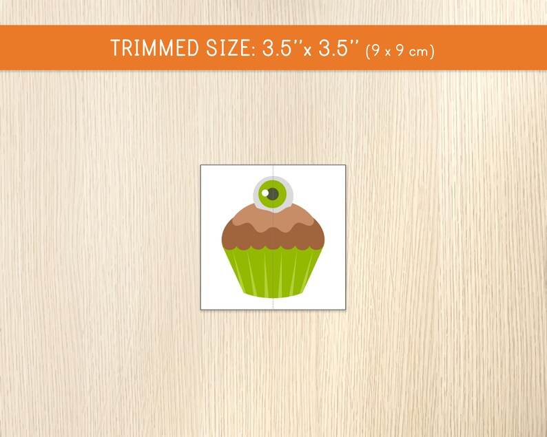 May include: A Halloween-themed puzzle featuring a cartoon cupcake with a brown top, green wrapper, and a large eyeball on top. The trimmed size is 3.5" x 3.5".