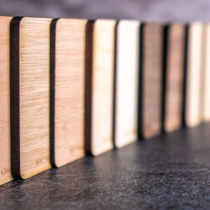 samples of plywood standing in a row.