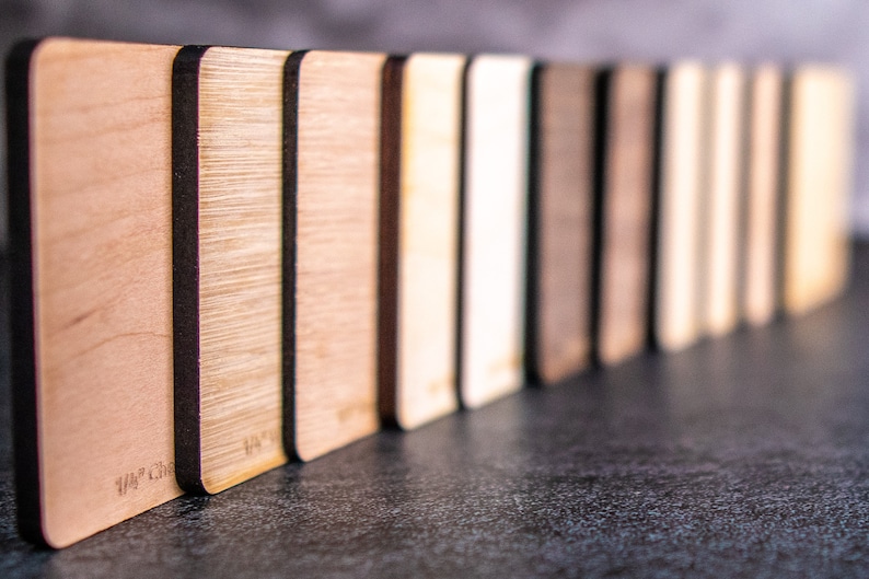 samples of plywood standing in a row.