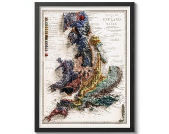 May include: A vintage, detailed, embossed map of England and Wales. The map is printed in black and white with colored accents. The map shows the geographical features of the region, including mountains, rivers, and coastlines.