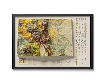 May include: A framed vintage-style topographic map of Colorado with a 3D relief effect. The map is printed on a cream-colored background with brown, green, yellow, and red colors. The map is titled "Topographic Map of Colorado" and includes a legend and scale.