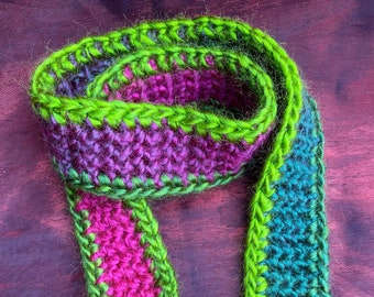 Pink and green crocheted scarf for dolls and teddybears, vibrant coloures. Measurements 55cm x 3cm.