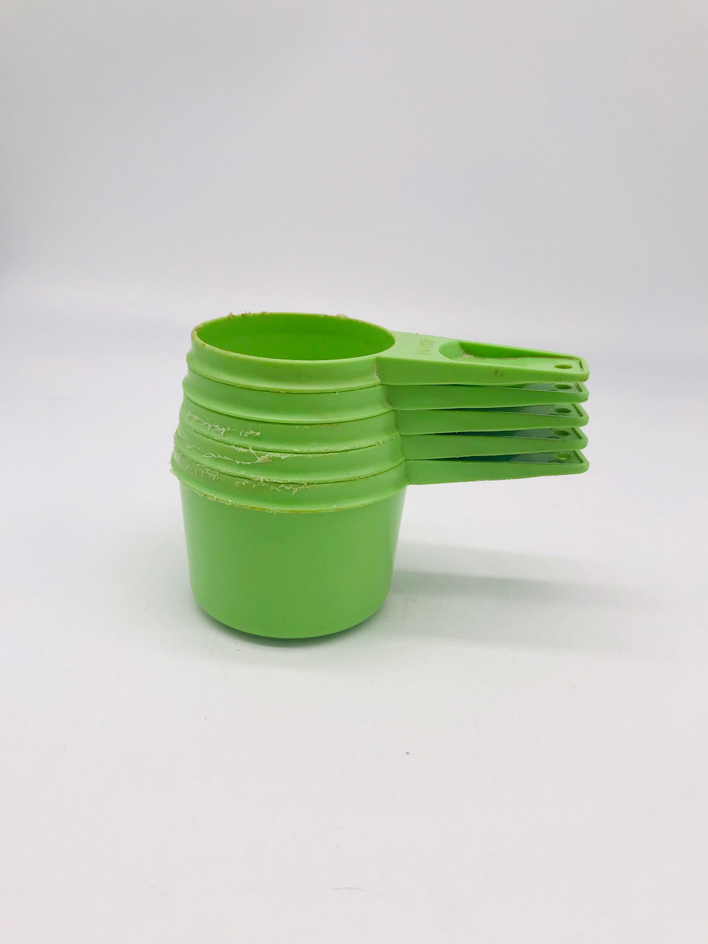 Green Tupperware Measuring -