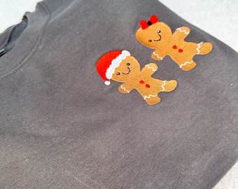 Sudadera navideña con hombre y mujer de jengibre y luces