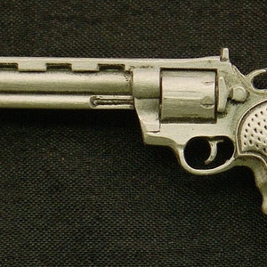 May include: A silver revolver with a textured grip. The gun is a replica and is not a real firearm.
