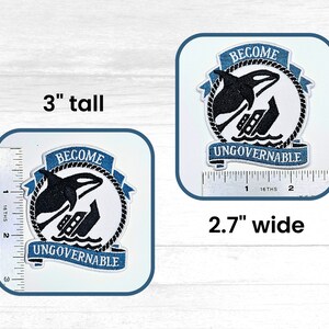May include: A blue and white embroidered patch with a black and white orca jumping over a sinking ship. The patch is 3 inches tall and 2.7 inches wide. The text on the patch reads "Become Ungovernable".