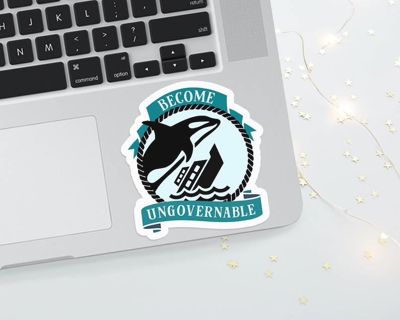 May include: A teal and white sticker with a black orca jumping out of the water and a black ship sinking. The sticker has the text "Become Ungovernable" in a white banner.