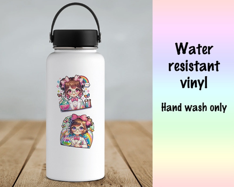 May include: White water bottle with two colorful stickers featuring a cartoon scientist girl with brown hair, glasses, and a lab coat. The stickers have a rainbow, butterflies, and lab equipment. Text on the right says "Water resistant vinyl" and "Hand wash only."