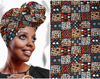 May include: A black head wrap with a colorful geometric pattern in shades of red, orange, blue, and white. The pattern features triangles, squares, and zigzags.