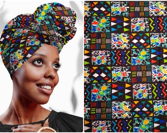 May include: A brown head wrap with a colorful geometric pattern. The pattern includes triangles, squares, and zigzags in shades of blue, green, yellow, red, and white.