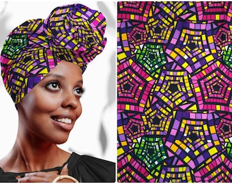 May include: A woman wearing a purple, pink, yellow, and green patterned head wrap. The wrap has a geometric design with a black background.