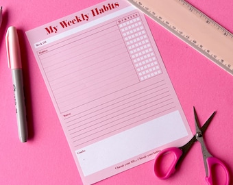 May include: A pink printable weekly habit tracker with a grid for tracking daily habits. The tracker has the text "My Weekly Habits" at the top and includes sections for "Week Of", "Habits", "Notes", and "Goals".