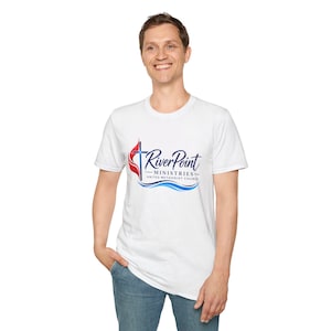 May include: A white short-sleeved t-shirt featuring a graphic logo on the chest. The logo includes a red flame, a blue cross, and the text RiverPoint MINISTRIES UNITED METHODIST CHURCH in blue and black, with blue wavy lines underneath.
