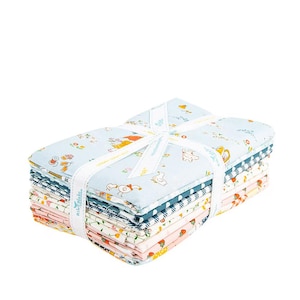 May include: A stack of fabric bundles tied with a white ribbon. The fabric features various patterns, including floral, animal, and geometric designs in pastel colors. The ribbon is printed with the text "Riley Blake".