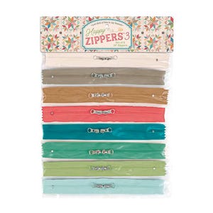 May include: A package of eight 16-inch zippers in various colors, including cream, gray, brown, coral, teal, green, and light blue. The package is labeled "Happy Zippers 3" and features a decorative header with a patchwork design.