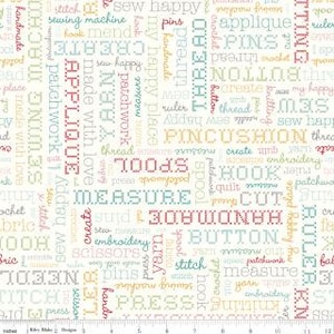 May include: White fabric with a repeating pattern of sewing-related words in various colors. Words include "handmade," "stitch," "measure," and "applique." The fabric is suitable for quilting and crafting projects.
