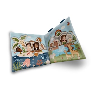 May include: A colorful felt book with pockets for playing a matching game. The book features animals, people, and nature scenes. The book is open to reveal the pockets and the pieces inside.