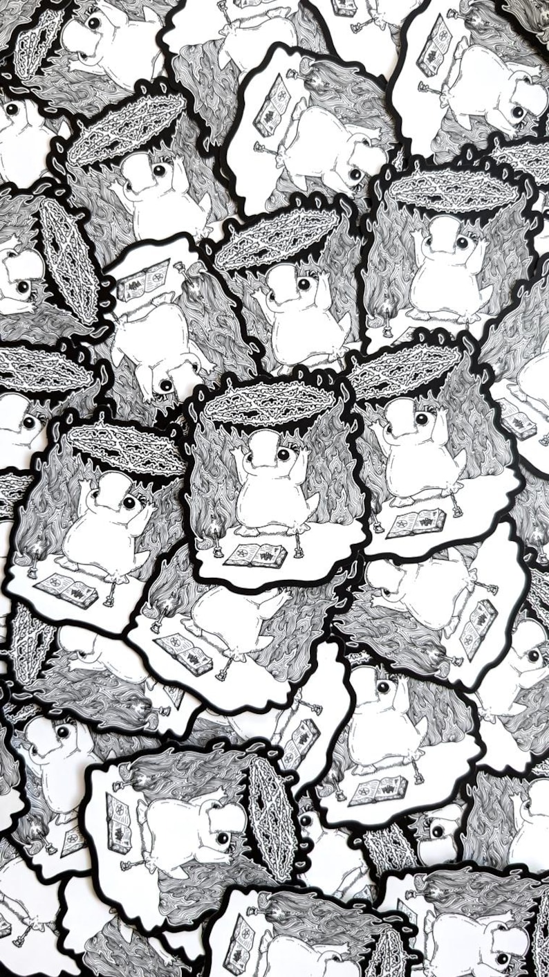May include: A stack of black and white stickers featuring a cartoon frog character performing a ritual with a pentagram and books. The frog is wearing a crown and has a surprised expression.