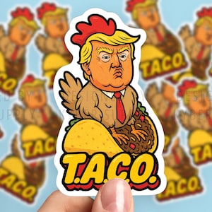 May include: A sticker featuring a cartoon image of a person's face with a rooster's body, wearing a red tie, and perched on a taco. The word "TACO" is in yellow and red block letters. The background is light blue.