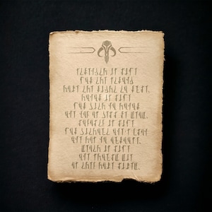 May include: A parchment scroll with a Mandalorian symbol at the top and text written in a fictional language. The text reads "TLETISZA AT FAST THE LAT PLENS MET LAT FASML L4 FEST. THE SILA YA MATLE MIT CAF AT STREET LETILE. FLEMELE IT FANT THE SALAMEL LITTL州 我們FLUTT. MIT TALEFLE LIT AT LATE MET 打上."