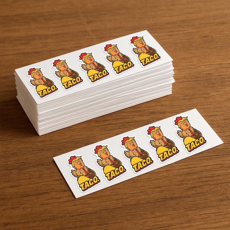 May include: A stack of white rectangular stickers featuring a cartoon image of a person with orange hair and a red tie, resembling a chicken, sitting in a taco shell. The word "TACO" is printed below each image.