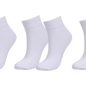 May include: Six pairs of white ankle socks. The socks are made of a soft, comfortable material and are perfect for everyday wear.